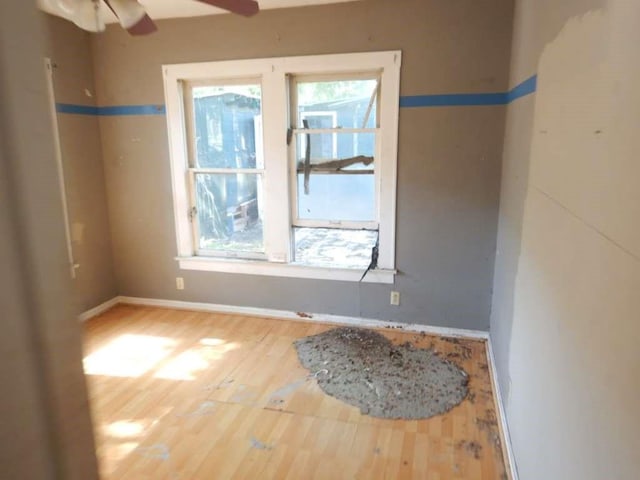 6636 Ave P, Houston, TX 77011 - empty room with wood finished floors, baseboards, and a ceiling fan