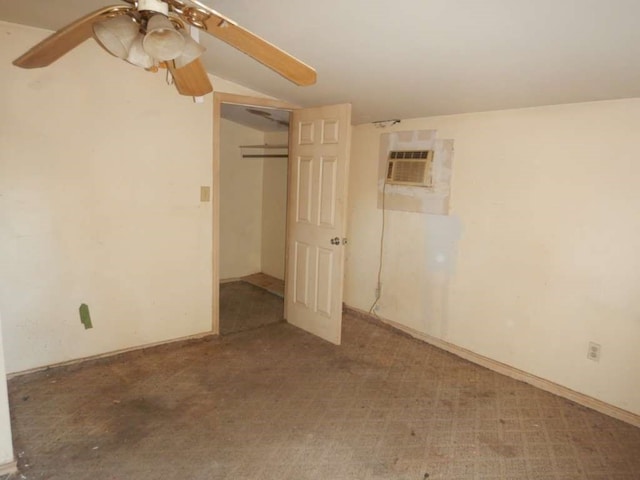 unfurnished bedroom with carpet, a closet, ceiling fan, and an AC wall unit