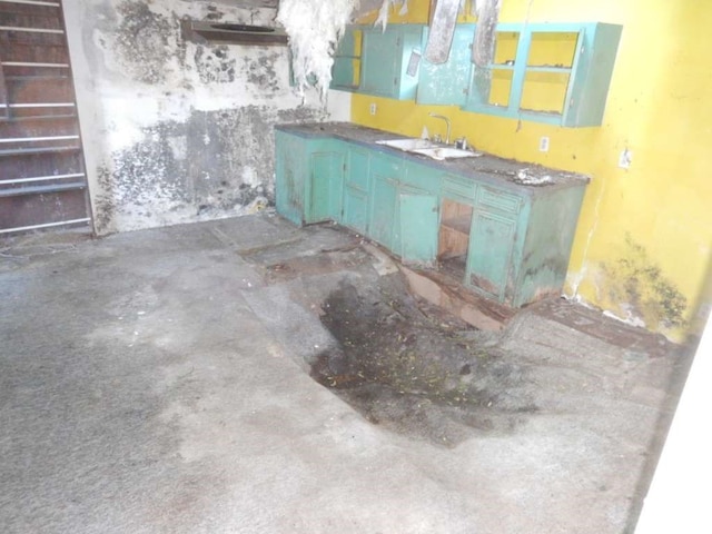 interior space with sink and concrete floors