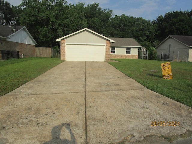 view of front facade with a front lawn and central air condition unit