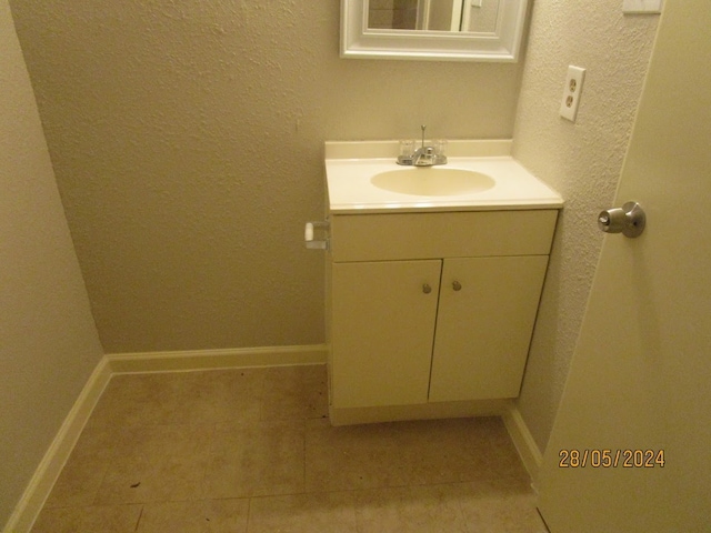 bathroom featuring tile patterned floors and vanity