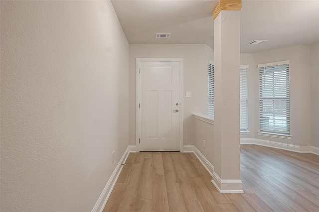 doorway with light hardwood / wood-style floors