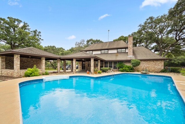 view of pool featuring a patio area