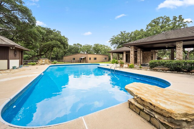 view of pool featuring a patio