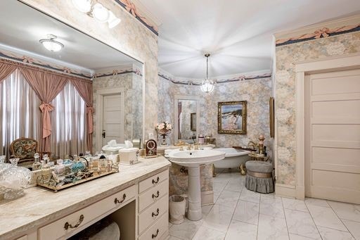 bathroom featuring tile floors and crown molding