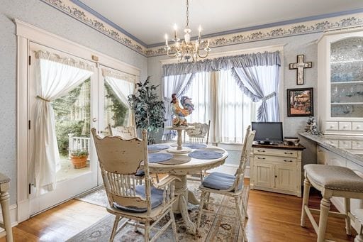 dining space with a chandelier and light hardwood / wood-style flooring