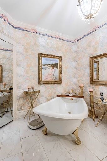 bathroom featuring crown molding and tile floors