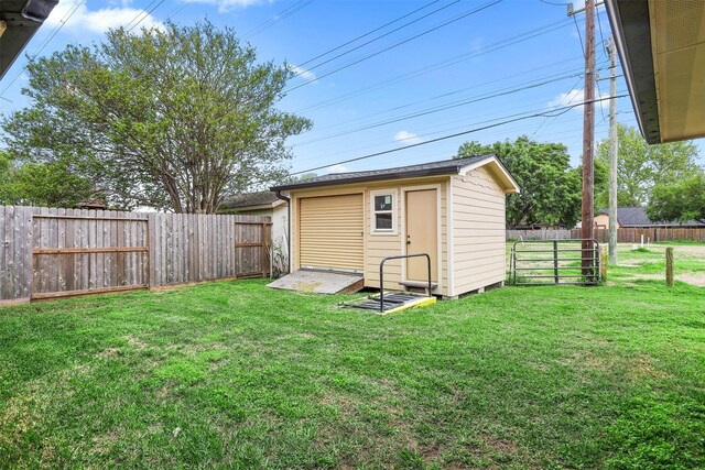 view of outbuilding featuring a lawn