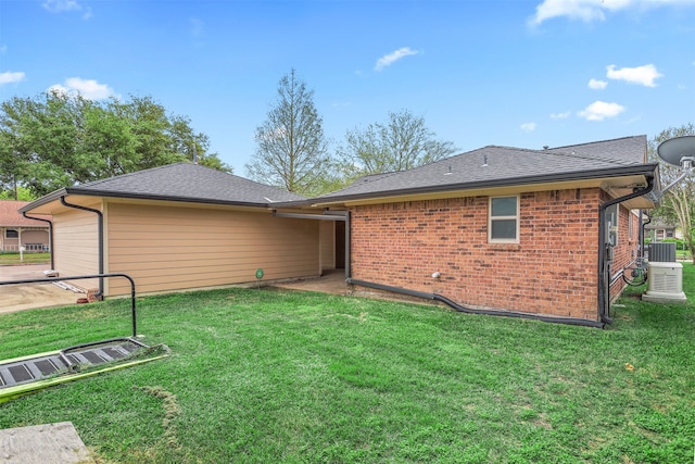 rear view of house with a lawn