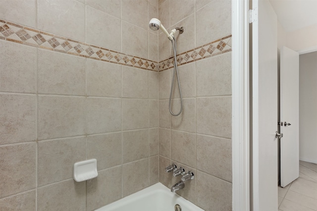 bathroom with tile patterned floors and tiled shower / bath