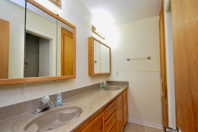 full bath featuring double vanity and a sink