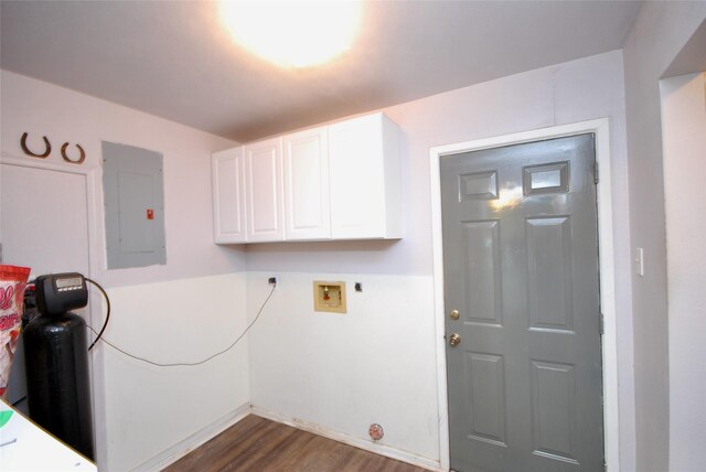 laundry room with hookup for a washing machine, dark wood-style floors, electric panel, electric dryer hookup, and cabinet space