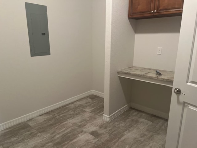 clothes washing area featuring tile flooring