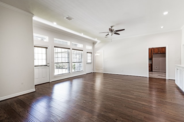 spare room featuring crown molding, dark wood-type flooring, and ceiling fan