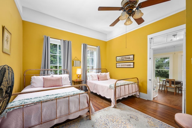 bedroom with ceiling fan and wood-type flooring