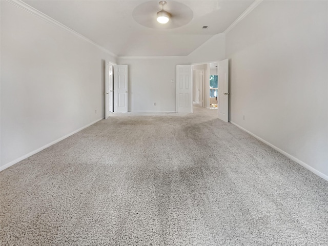 carpeted spare room featuring ceiling fan and ornamental molding