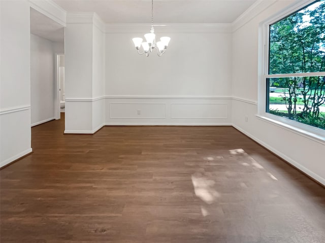 unfurnished dining area with a notable chandelier, ornamental molding, dark wood-type flooring, and a wealth of natural light