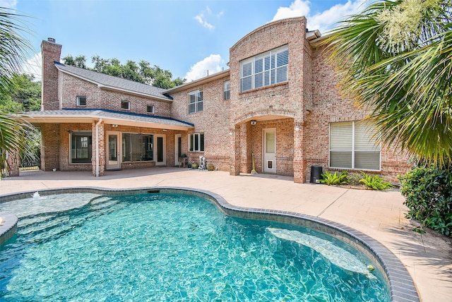 view of swimming pool featuring a patio