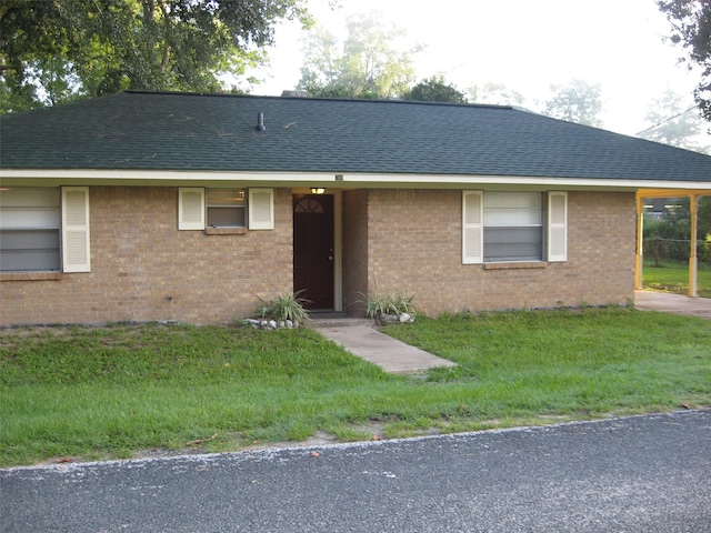 ranch-style house with a front yard