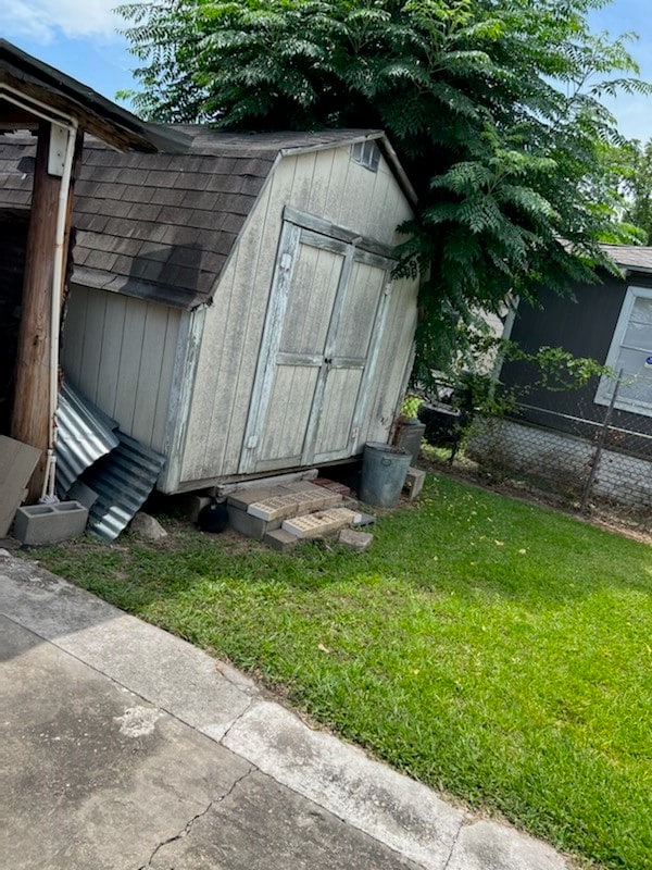 view of outdoor structure with a lawn