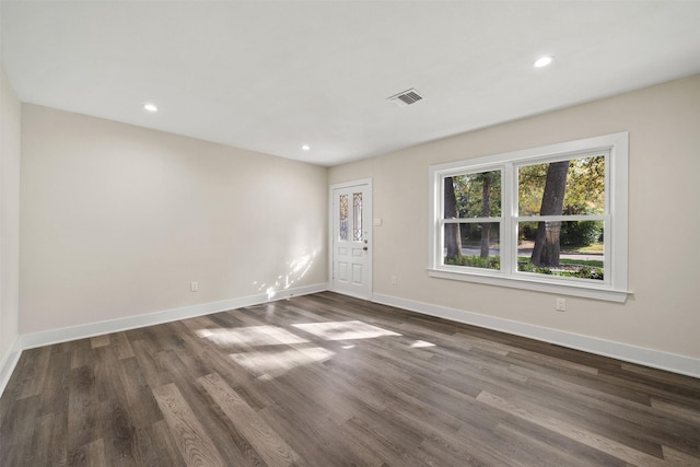 unfurnished room with dark hardwood / wood-style floors