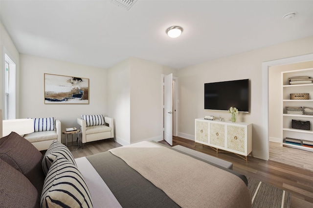 bedroom featuring dark hardwood / wood-style floors