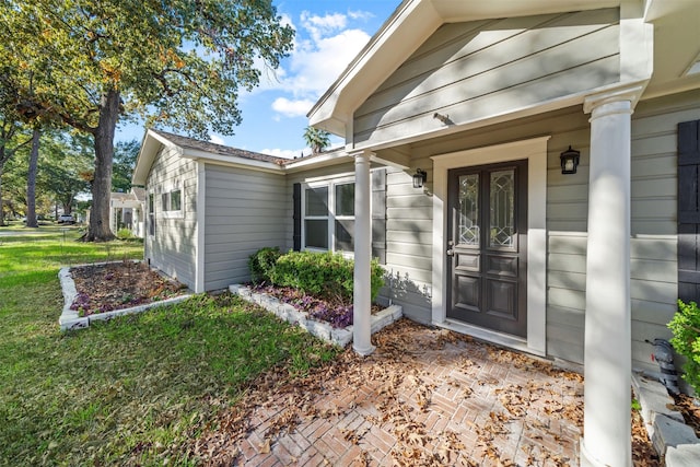 entrance to property with a yard