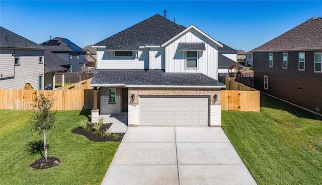 view of front of house featuring a garage and a front yard