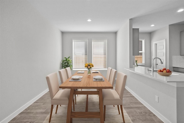 dining area featuring dark wood-type flooring