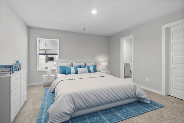 bedroom with light colored carpet