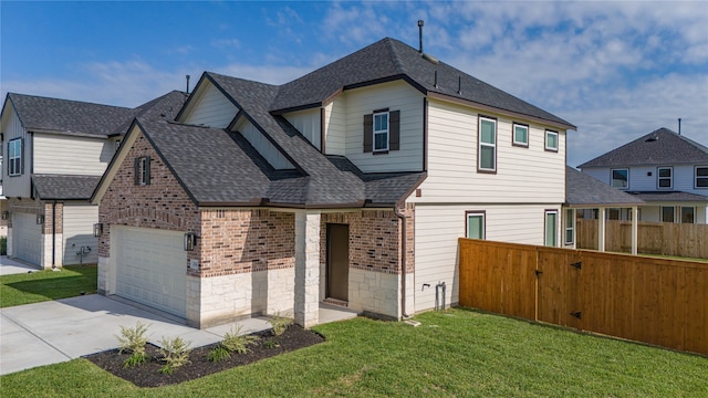 view of front of house featuring a front yard and a garage