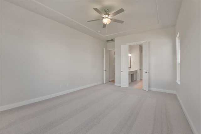 unfurnished room with ceiling fan and light colored carpet