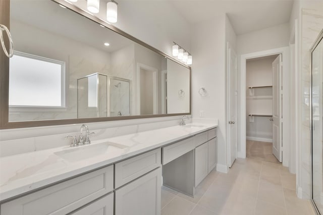 bathroom with vanity, tile patterned floors, and an enclosed shower