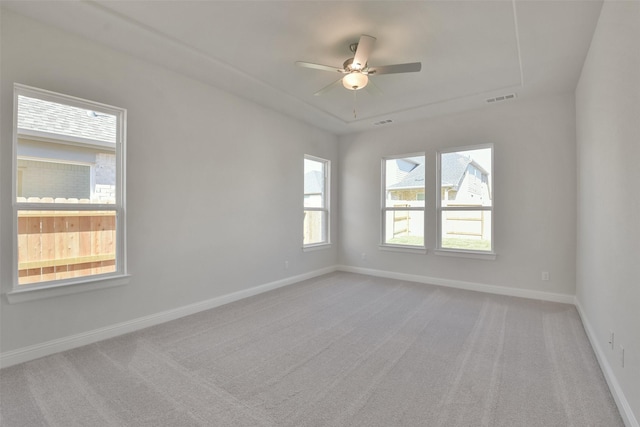 empty room with ceiling fan and carpet