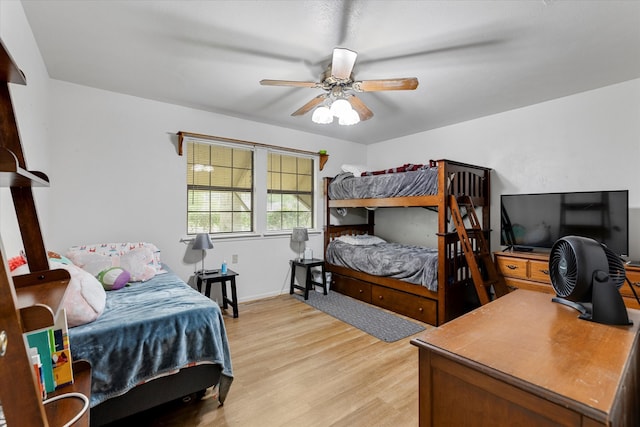 bedroom with ceiling fan and wood-type flooring