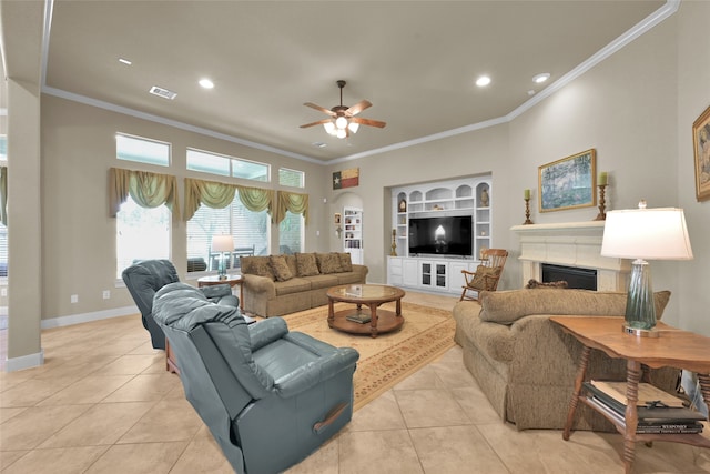 tiled living room with built in shelves, crown molding, and ceiling fan