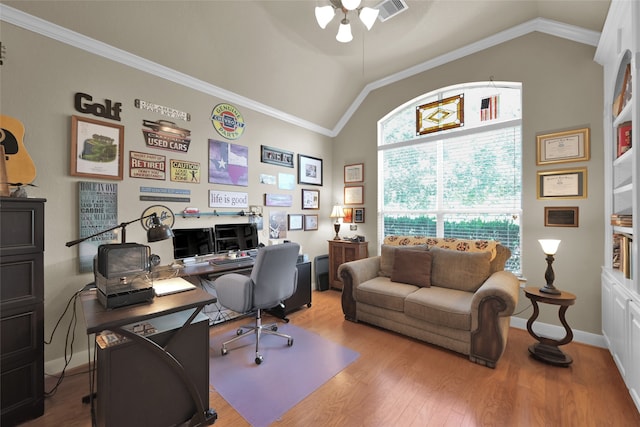 office space featuring lofted ceiling, ornamental molding, and hardwood / wood-style flooring