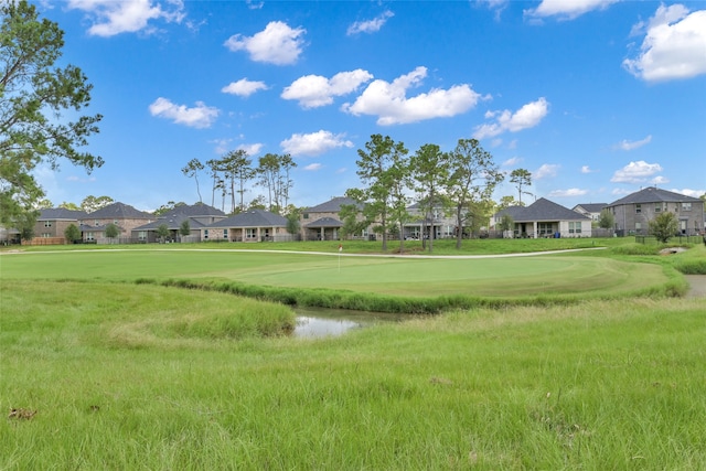 view of home's community with a lawn