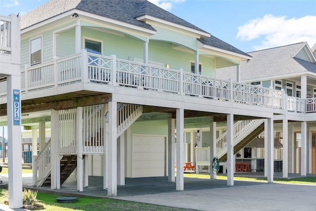 rear view of house featuring a garage