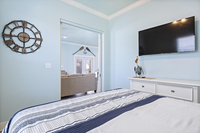 bedroom with french doors and crown molding