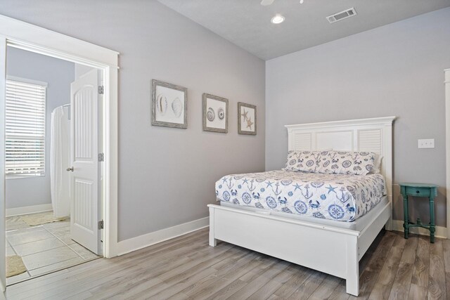 bedroom with hardwood / wood-style floors