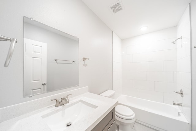 full bathroom with vanity, toilet, and tiled shower / bath