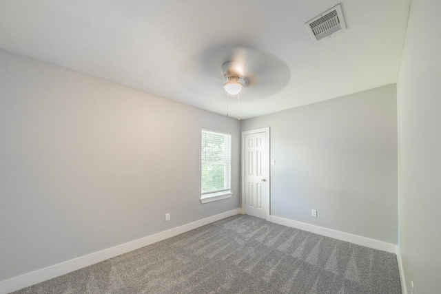 spare room featuring carpet floors