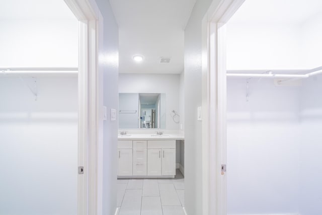 bathroom featuring tile patterned floors and vanity