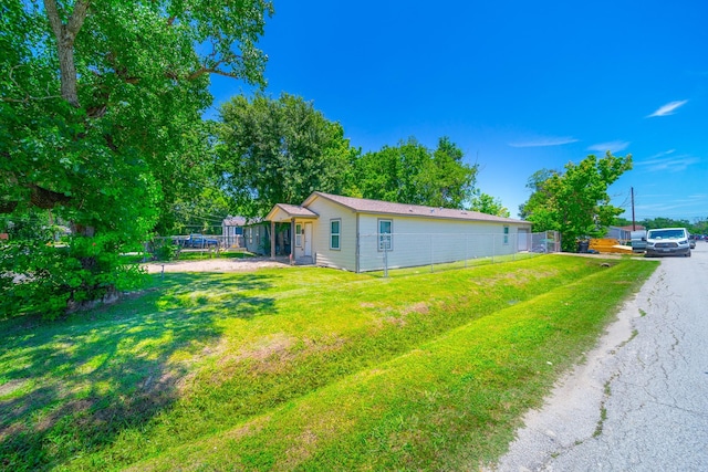 view of side of property featuring a yard