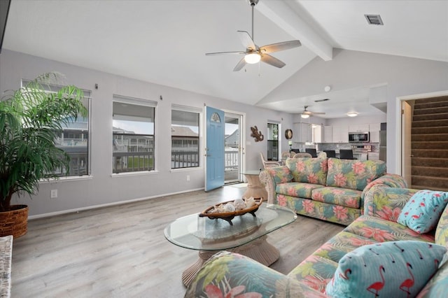 living room with vaulted ceiling with beams, light wood-type flooring, and ceiling fan