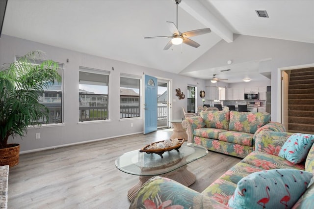 1220 Waterways Dr, Crystal Beach, TX 77650 - living room with stairs, lofted ceiling with beams, light wood finished floors, visible vents, and a ceiling fan