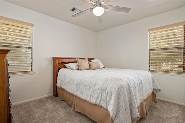 1220 Waterways Dr, Crystal Beach, TX 77650 - bedroom with baseboards, ceiling fan, visible vents, and light carpet