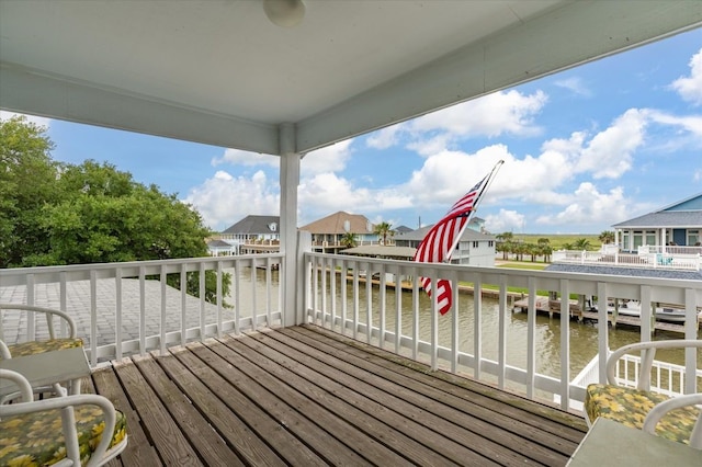 wooden deck featuring a water view