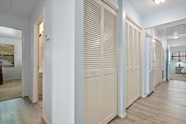 hallway featuring light hardwood / wood-style flooring